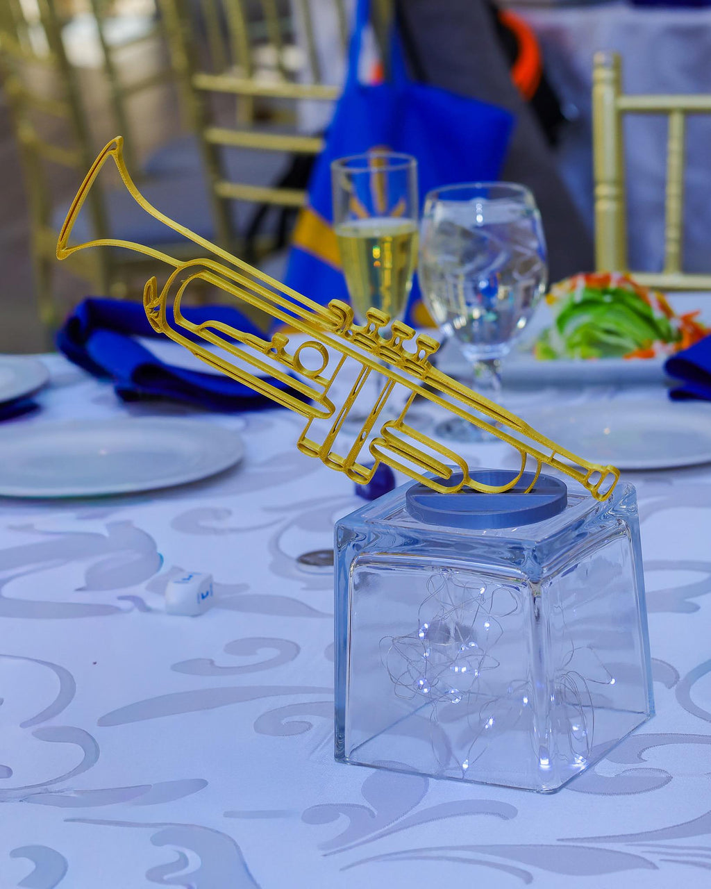 Gold band instrument banquet table centerpieces