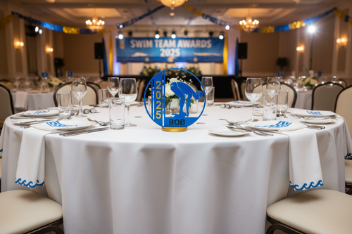 Swimming award on white tablecloth banquet table
